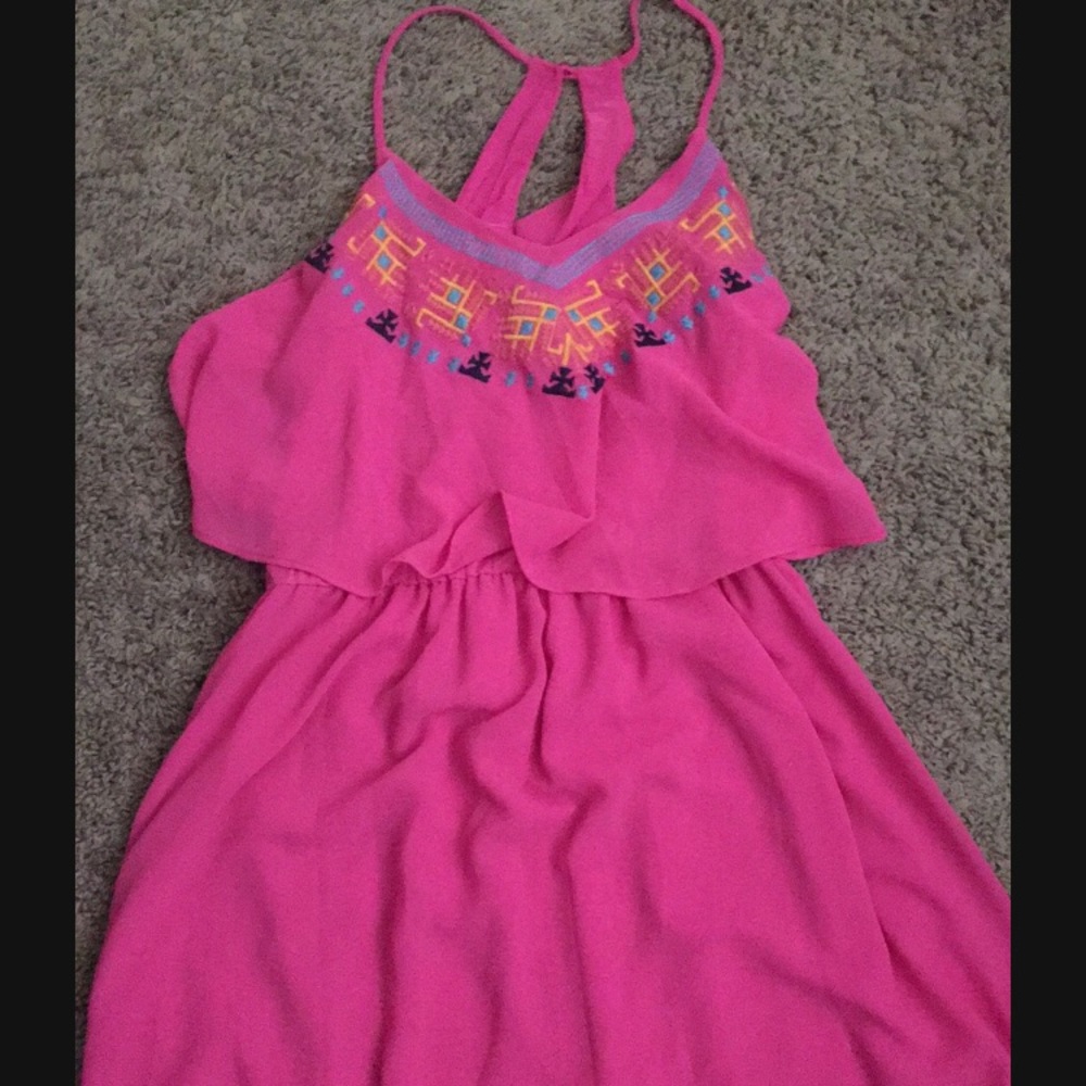 Pink dress with blue light blue and yellow triangl